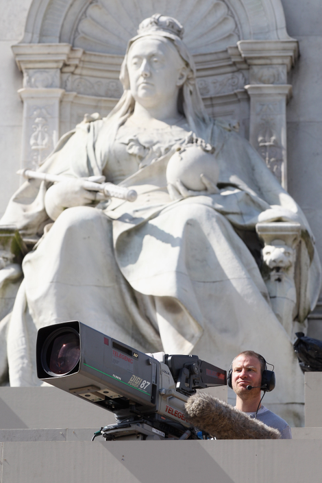 A cameraman in front of the Queen Victoria Memorial, ready for Will and Kate’s 2011 wedding outside Buckingham Palace. Photo: Getty.